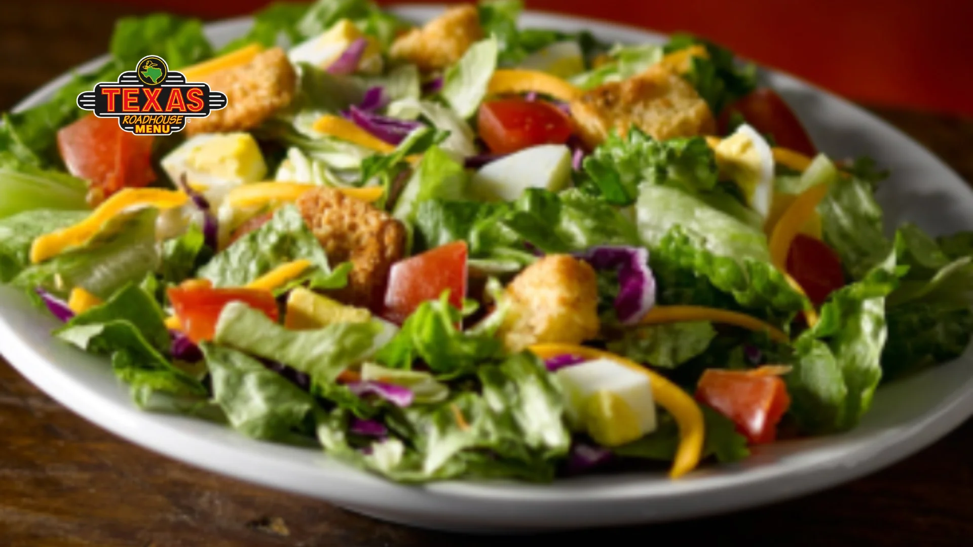 House Salad (Fresh greens, cheddar cheese, tomato, eggs and croutons..)