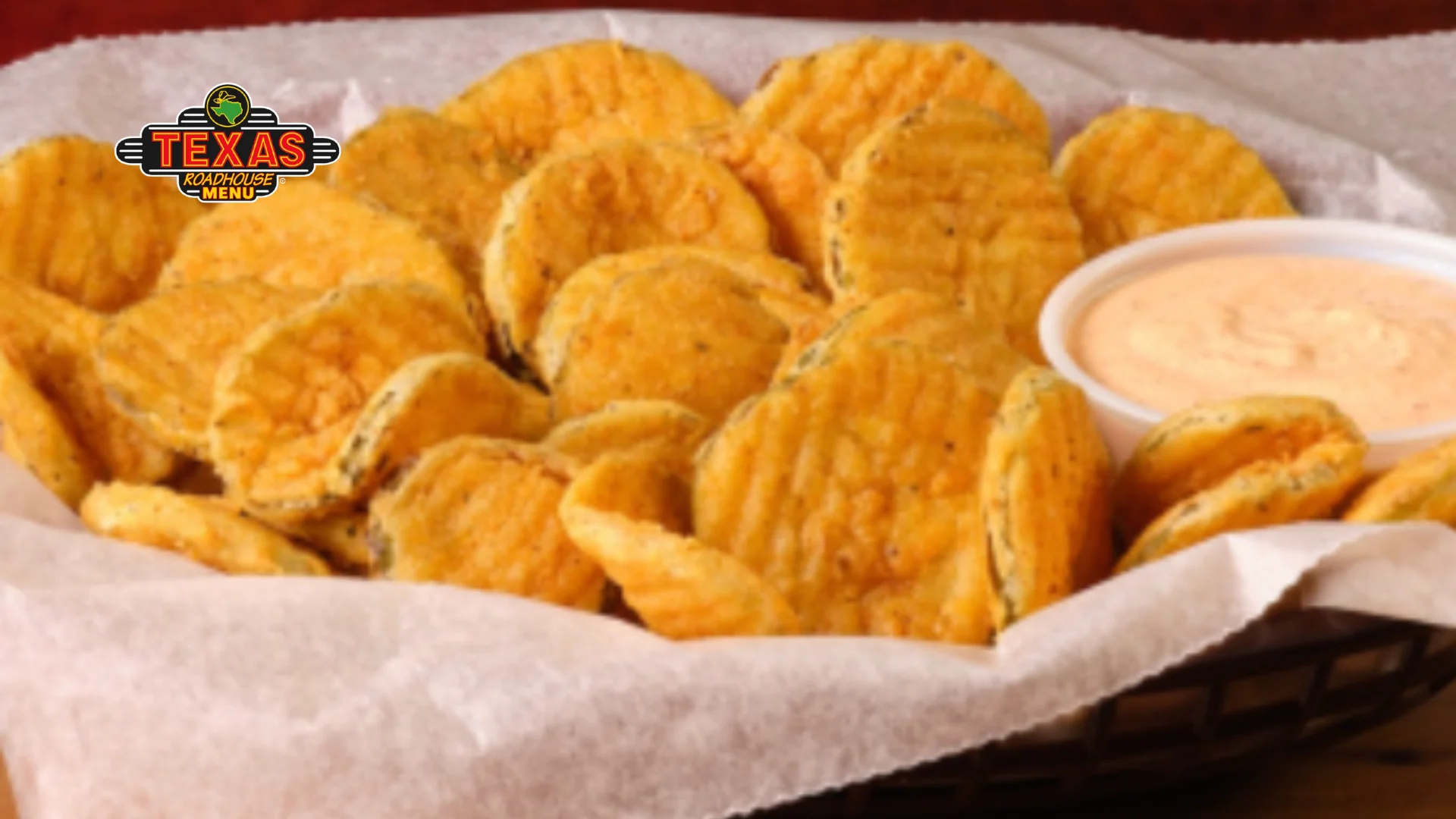 Fried Pickles served in a basket with sauce