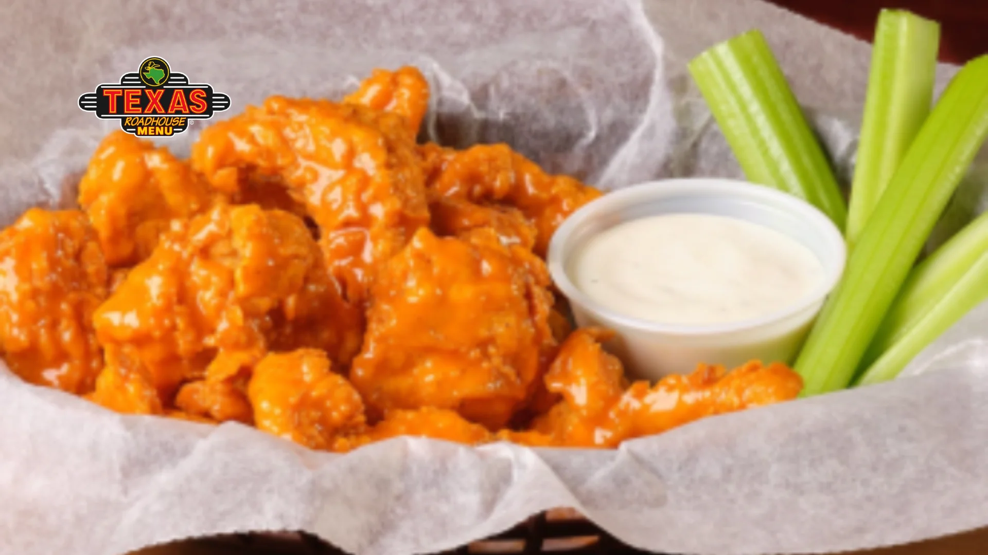 Boneless Buffalo Wings served with salad and sauce that makes it delicious