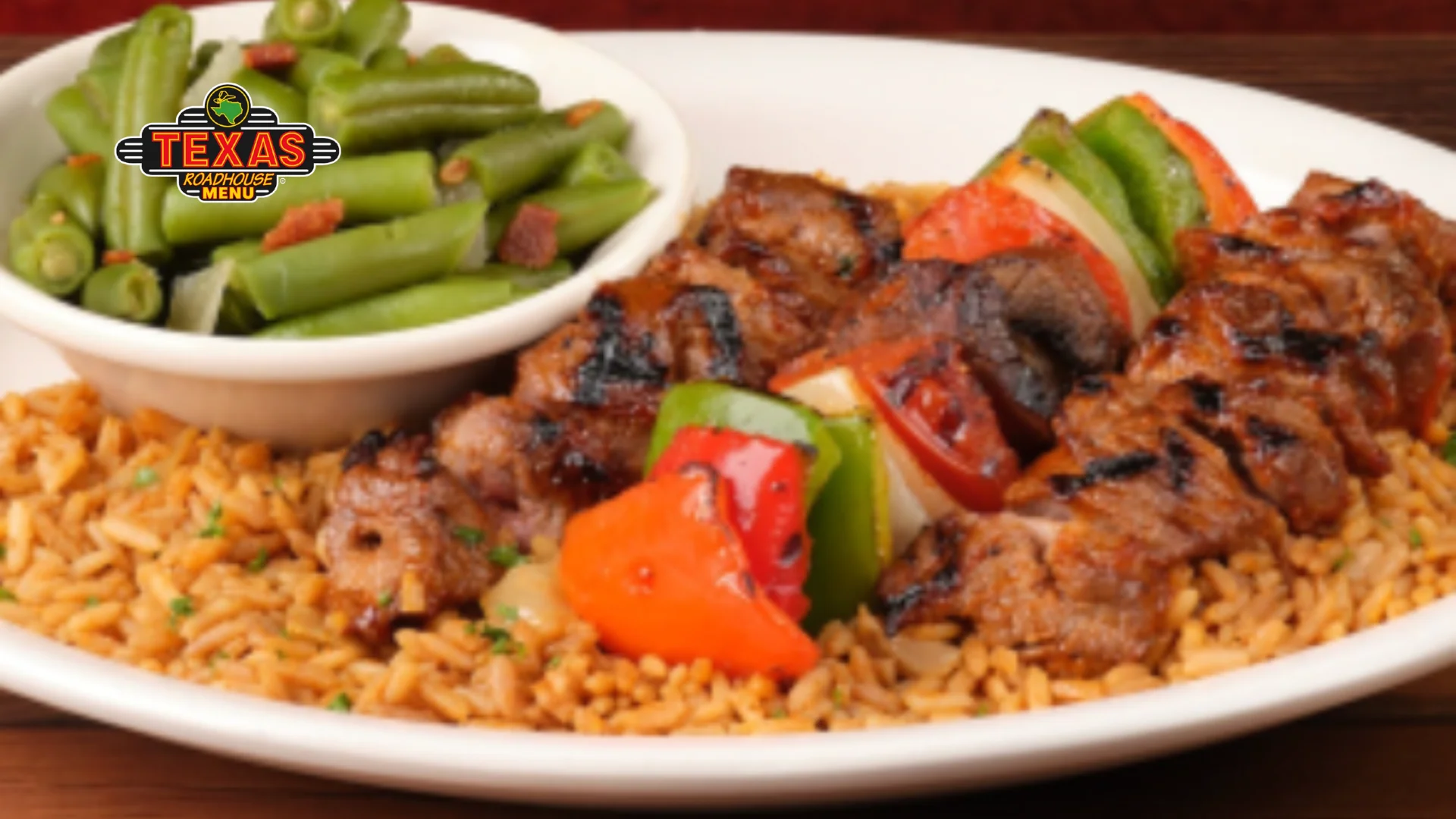 Steak Kabob is a full plate with rice and salad